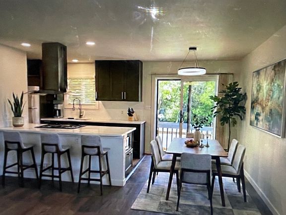 Kitchen and dining area virtually staged.