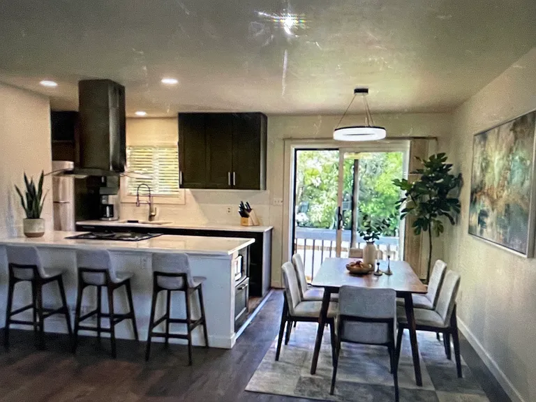 Kitchen and dining area virtually staged.