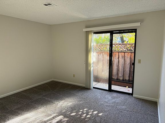 Master bedroom with sliding glass door to backyard