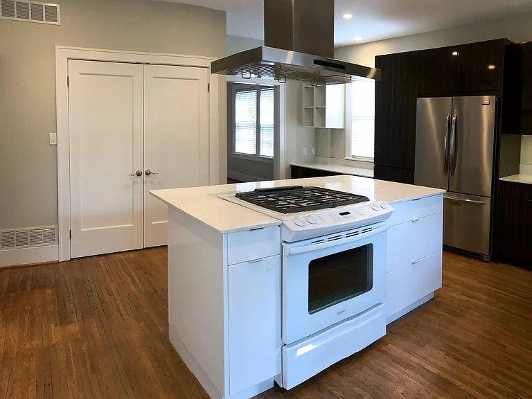 Gloss White Island with white quartz countertops. Top of the