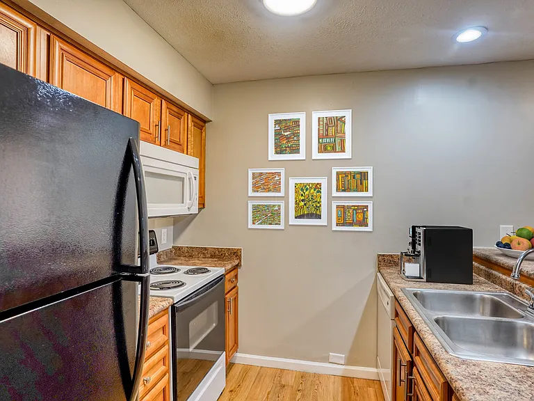 Elevate your culinary space at McCarty Place Apartments. This modern kitchen features sleek appliances, beautiful cabinetry, and a chic ambiance, perfect for cooking and entertaining. Don't miss outschedule your tour today!