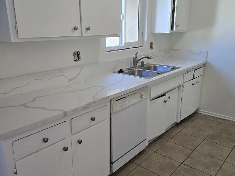 new quartz countertop. new kitchen sink. new kitchen fauceat