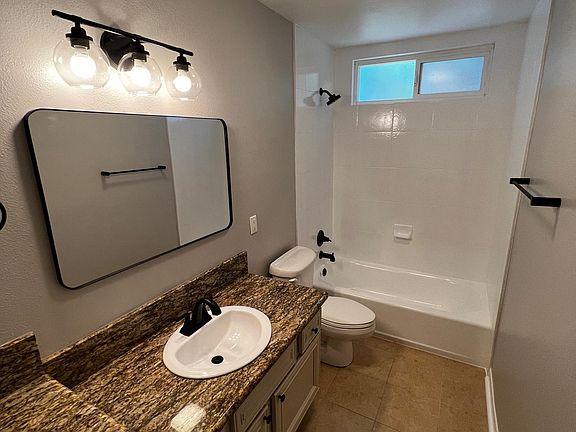 Granite counters with new black fixtures!