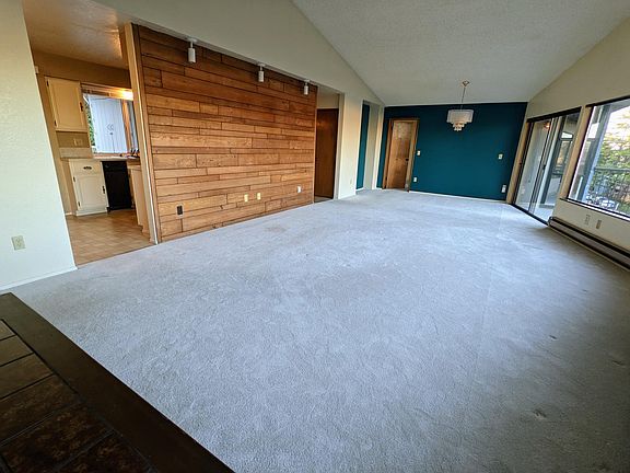 Living room, kitchen on left