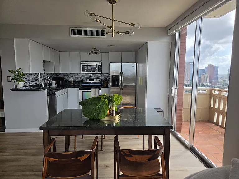 Dining area with side balcony view
