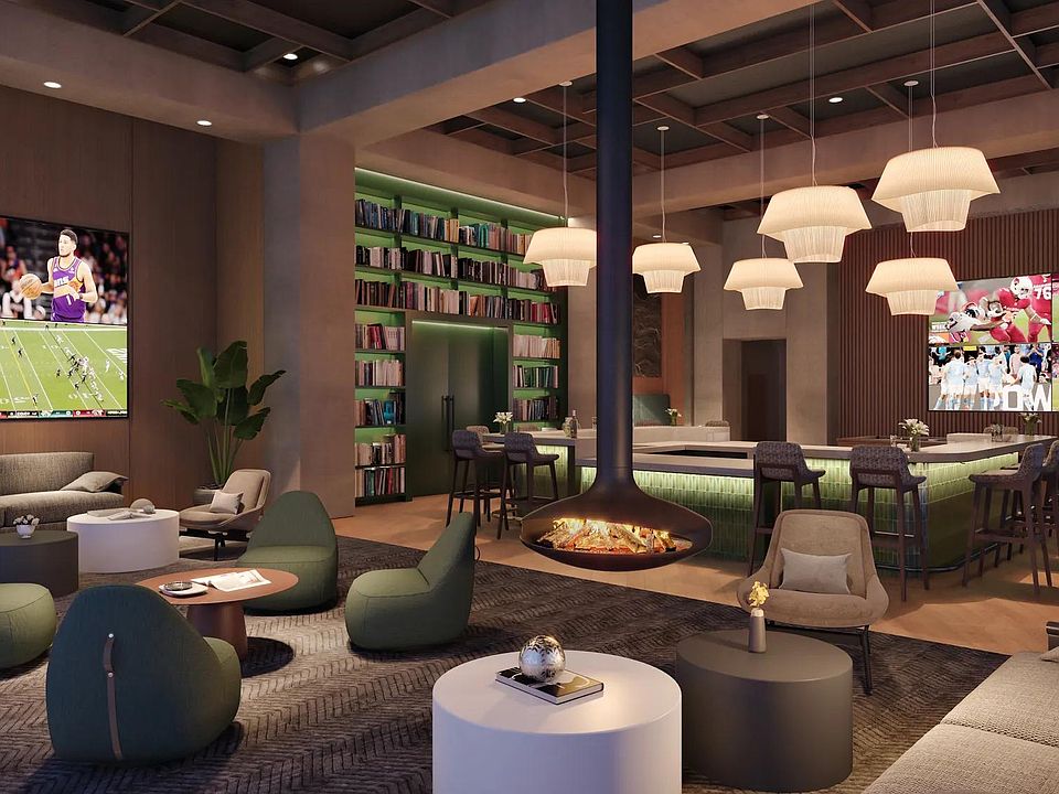 Entertain guests in the expansive clubroom with multiple gathering spaces. and suspended fireplace
