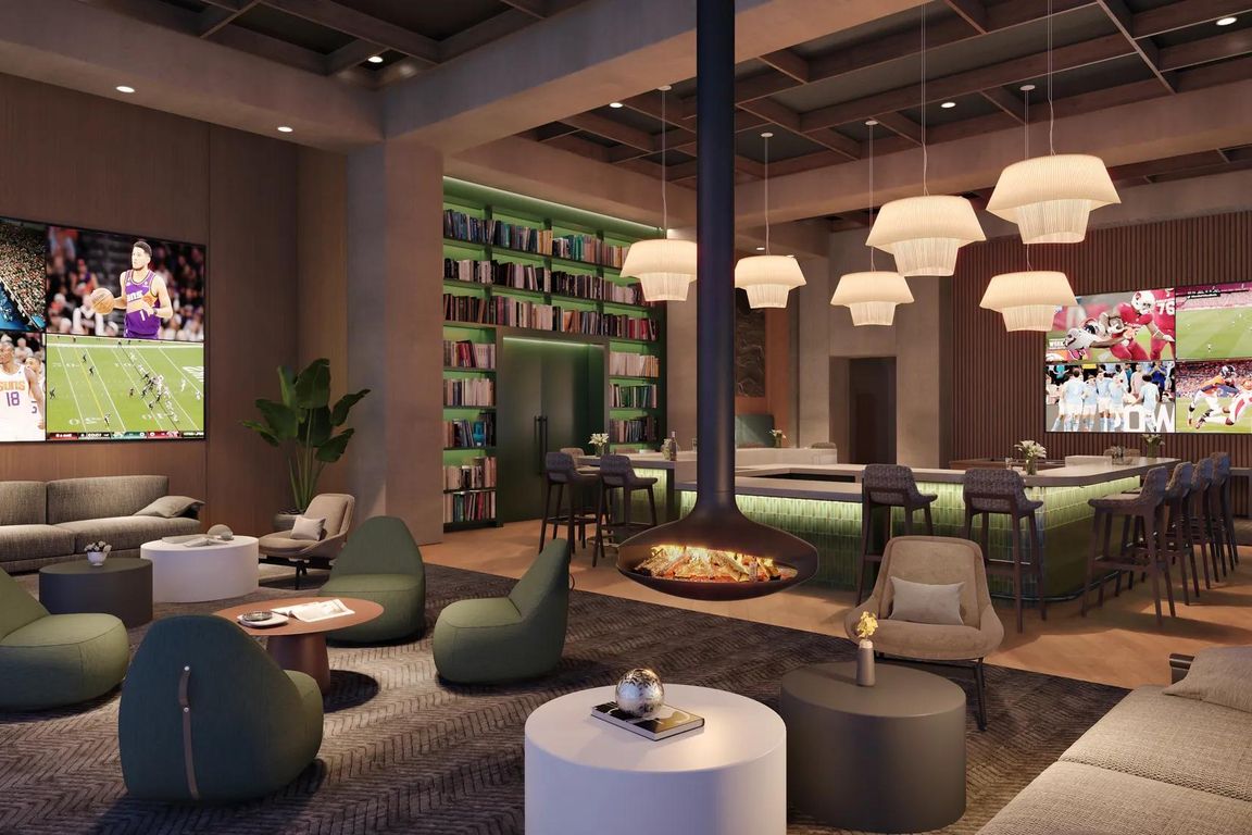 Entertain guests in the expansive clubroom with multiple gathering spaces. and suspended fireplace