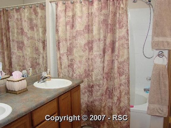 Master bathroom with large walk-in closet and double sinks