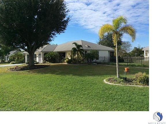 Side of house with view of backyard