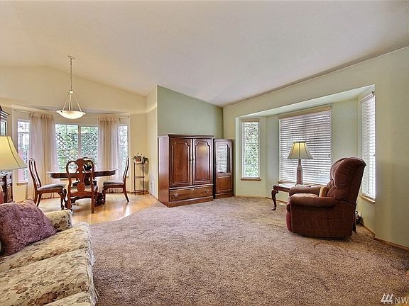 Note the abundance of windows, including the large bay windows in these rooms. A very light-filled home.