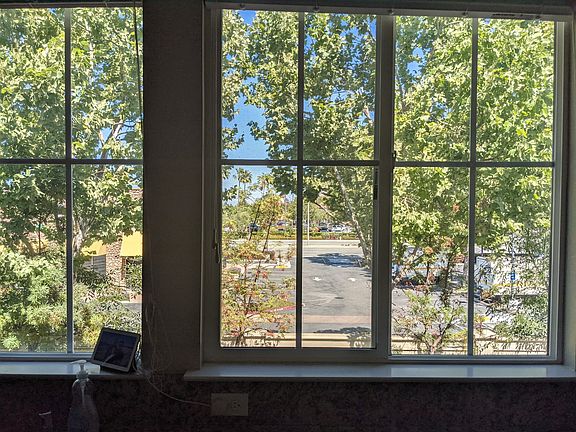 Rare end unit privacy with green-belt views