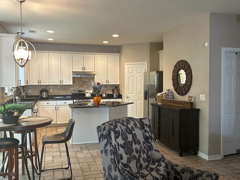 Updated kitchen featuring granit countertops and new appliances, new garnet disposal and sink, built-in pantry offering both style and functionality!