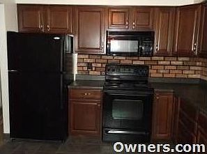 Kitchen with included appliances and ceramic tile flooring
