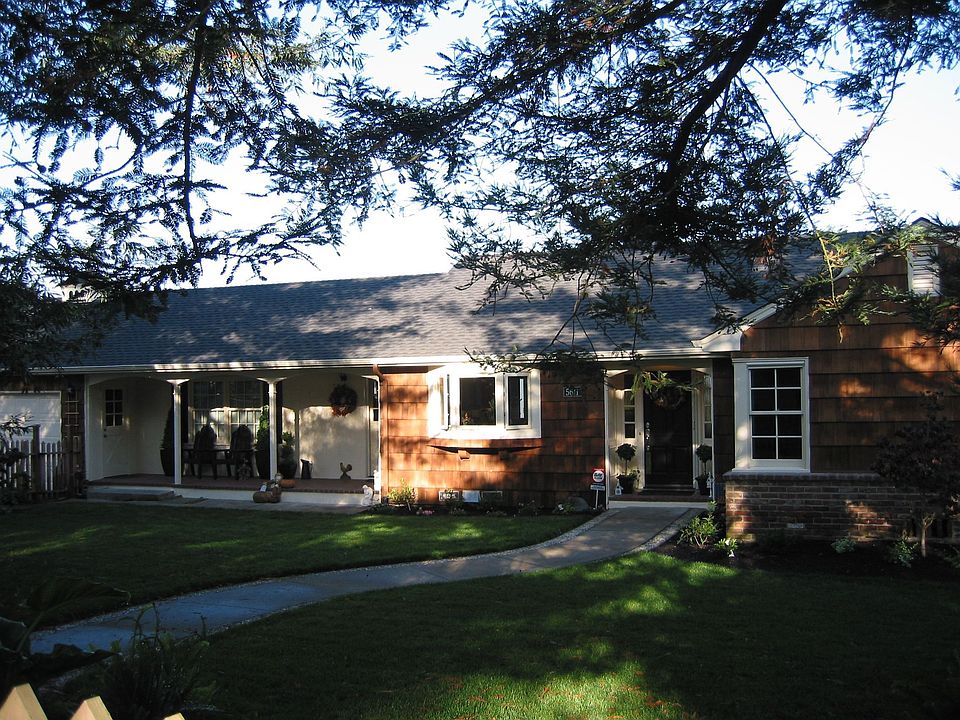 Redwoods shade the front garden