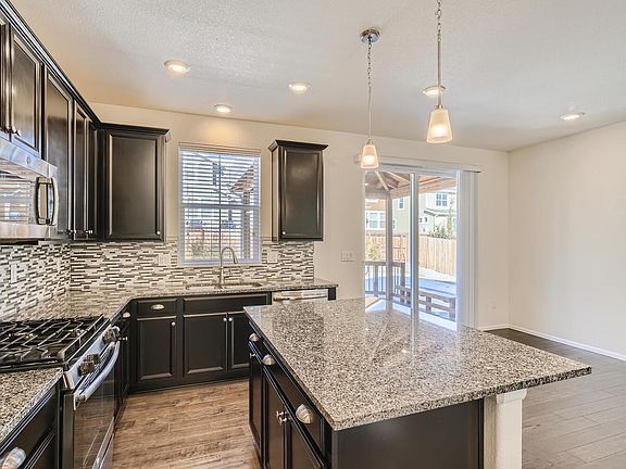 Gas range. Gorgeous wood floor.