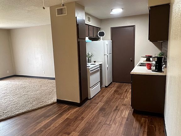 Dining room and kitchen with view of living room