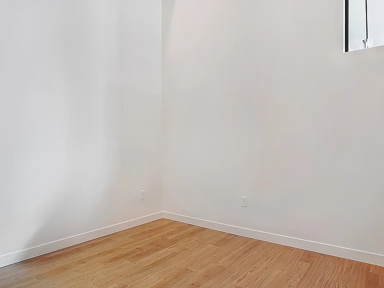 A bright secondary bedroom with flexible layout options.