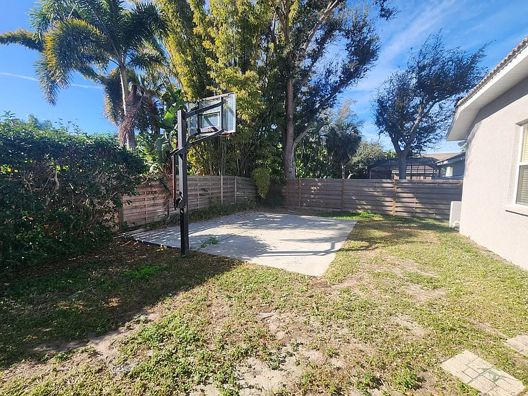 Back yard with a basketball hoop