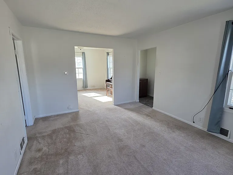 Living room looking toward front entry and dining room