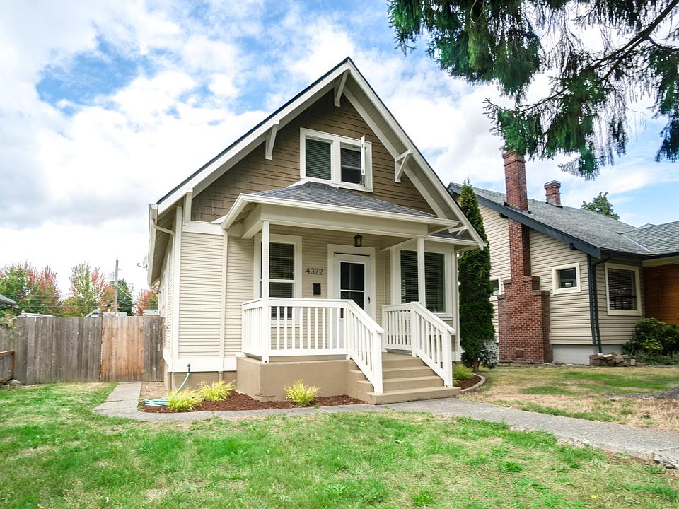 Large front yard w/ covered porch on wonderful tree lined street