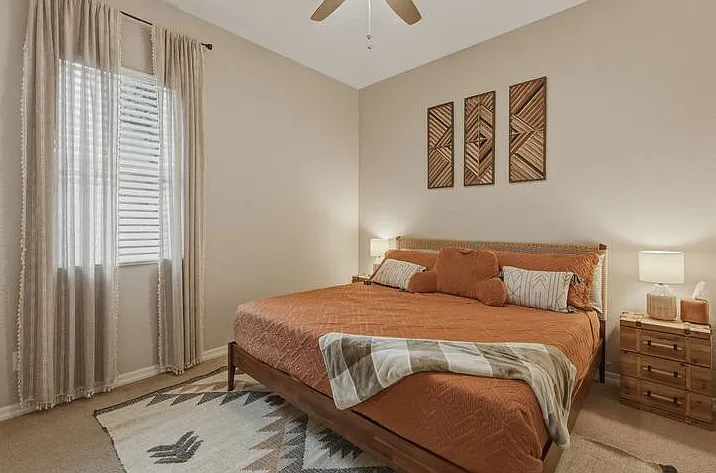 Your perfect escape: a luxurious king bed in the guest bedroom with shared Jack and Jill attached bathroom.