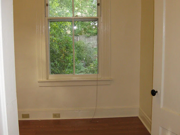 Back room functions as a large study or small bedroom (no closet)