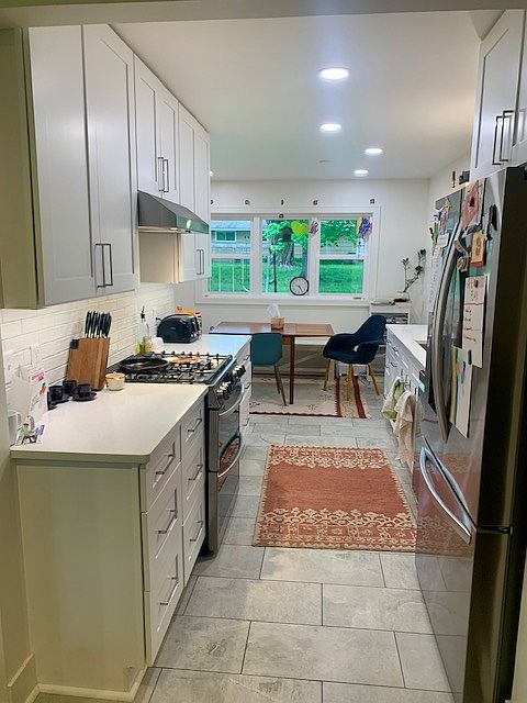 Updated Kitchen 2024 - beautiful tile floors, quartz countertops, all new appliances (double oven with air fryer!)