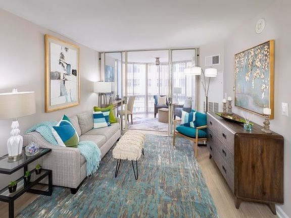 Newly Renovated Apartment With Wood-Style Flooring Throughout Kitchen and Living Areas With Sunroom