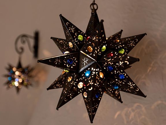 Colorful tin stars lights custom-made in San Miguel de Allende, Mexico.