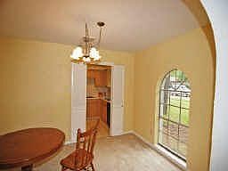 FORMAL DINING ROOM ... COULD BE FORMAL LIVING TOO, LONG, LOW WINDOW BRINGS THE SUNLIGHT INSIDE