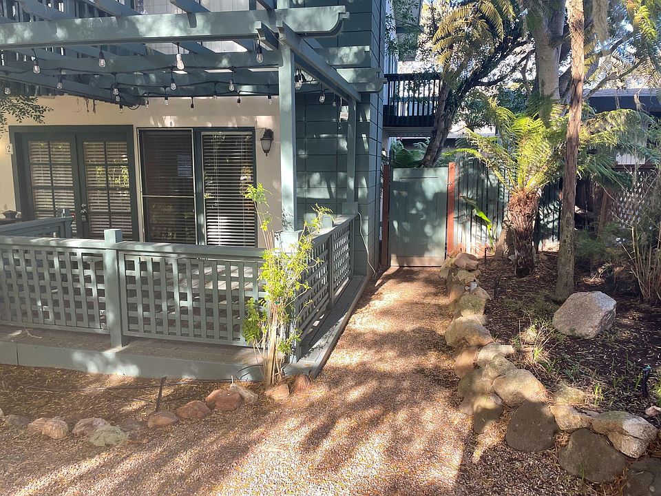 Front of unit and gate to side yard