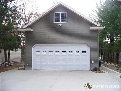 2 car finished extra wide garage with large concrete approach