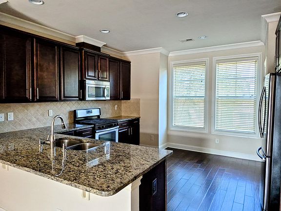 Gourmet kitchen with stainless appliances and granite countertop
