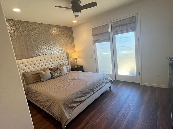 Bedroom-1 1 Bedroom w/ attached bath ( First Floor ) Wooden Flooring , Recessed Lights , Ceiling Fan & Nest Thermostat In-room closet Large french doors with access to private patio
