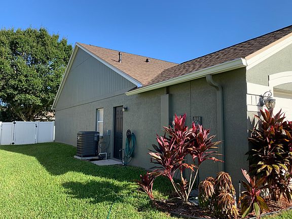 Left side of home, with new A/C unit (2016)
