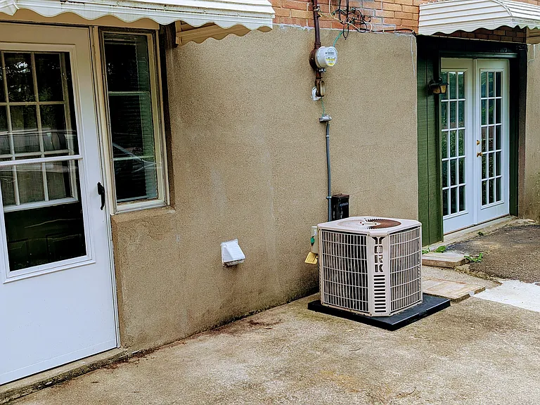 Two entrances lead into the lower level with a large parking area just off the back of the house.