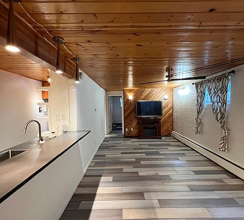 Living area, new flooring throughout.