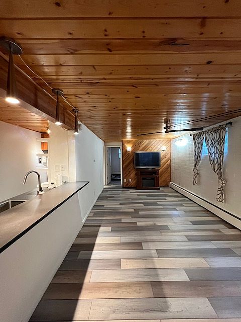 Living area, new flooring throughout.