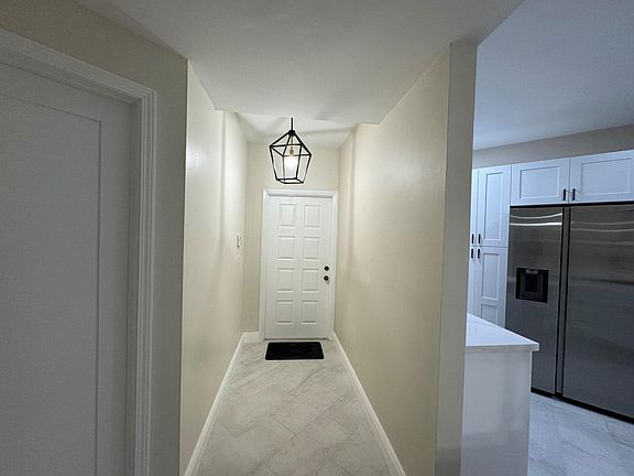 Front Entrance
Light cream paint color is the same throughout the condo.