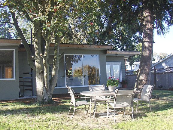 French doors into private backyard & spiral stair leading to roof 