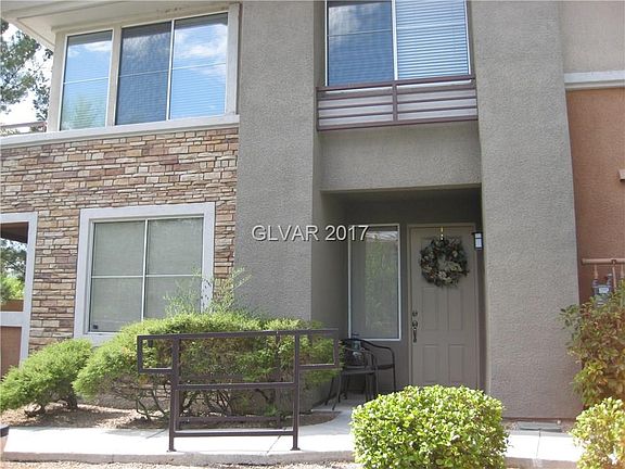 Unit 101 front door with sitting area.