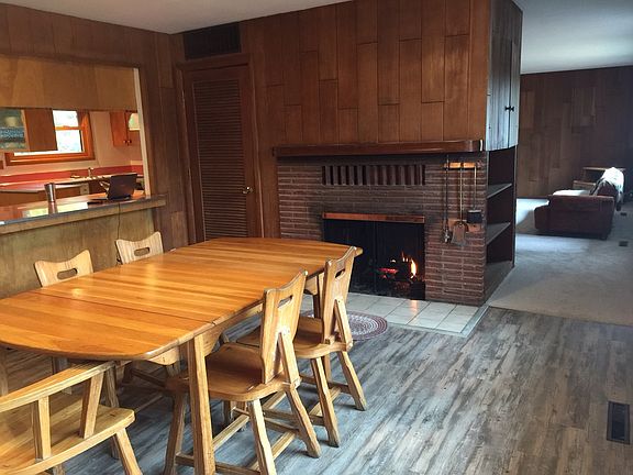 Back to back fireplaces warm the open dining room/living roo