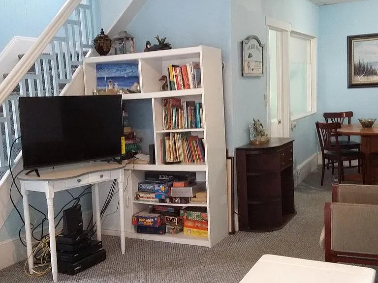Stairway leads to 2 bedrooms upstairs on west side of house. Rest of apartment is downstairs.