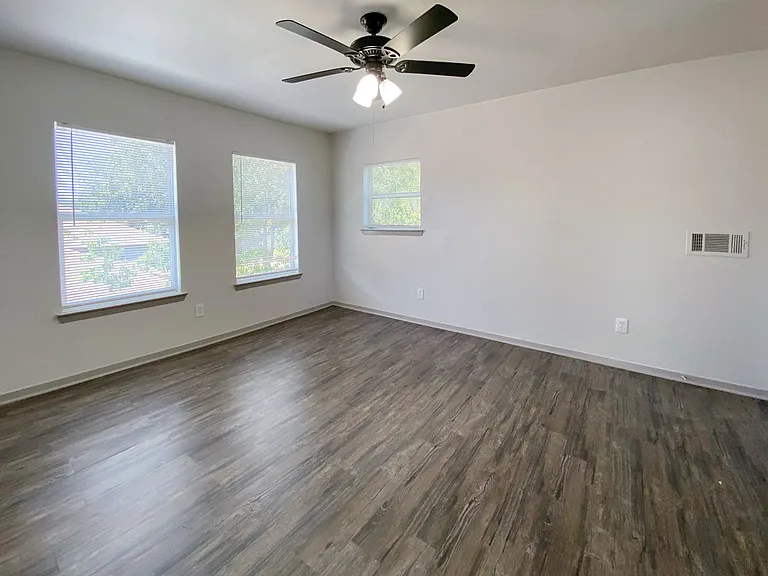 Upstairs bedroom with plenty of natural light and ample closet storage space for personal belongings