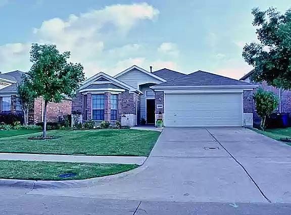 Front of house, brick and stone facade w 2 car garage