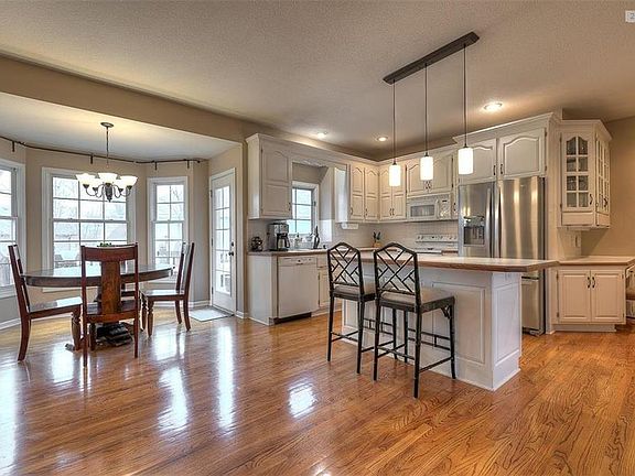 Hearth room, breakfast room and kitchen with wood floors