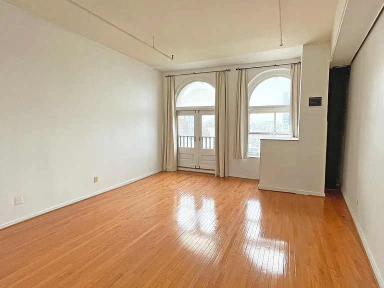 Spacious 16 ft. x 16.4 ft. living area with high ceiling