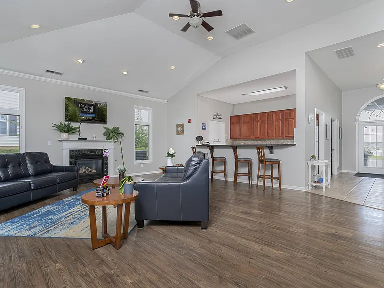 Relax by the fireplace or catch your favorite shows in a stylish, comfortable living space.