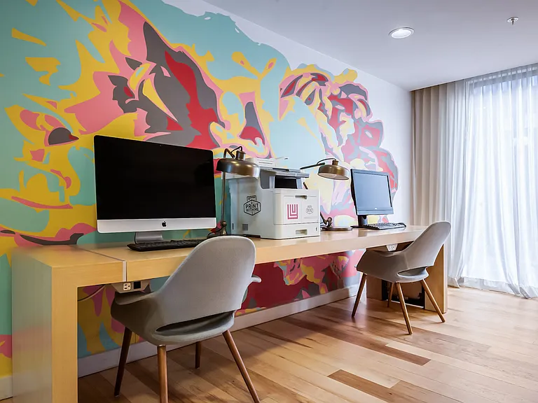 Resident Lounge Featuring Computers, Printer, and Modern Art Wall