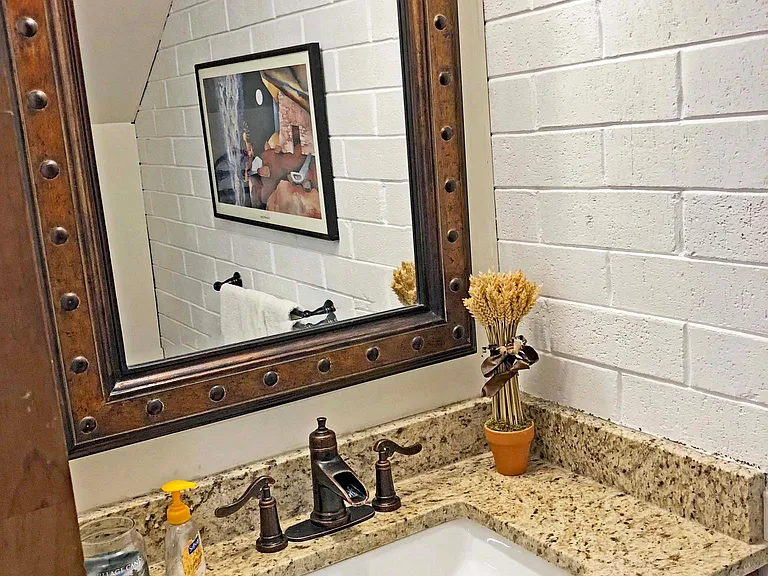 The downstairs half bath has a granite countertop.